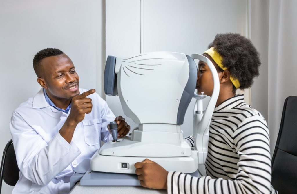 A woman undergoing an eye exam to monitor her recovery from laser eye surgery.